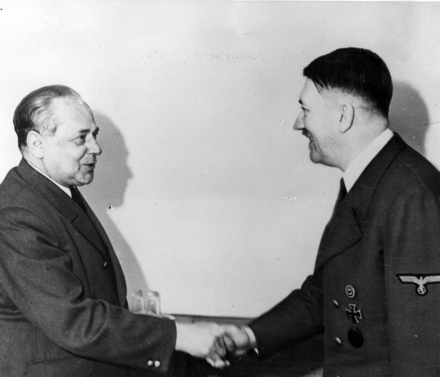 Adolf Hitler greets his personal photographer, Heinrich Hoffmann